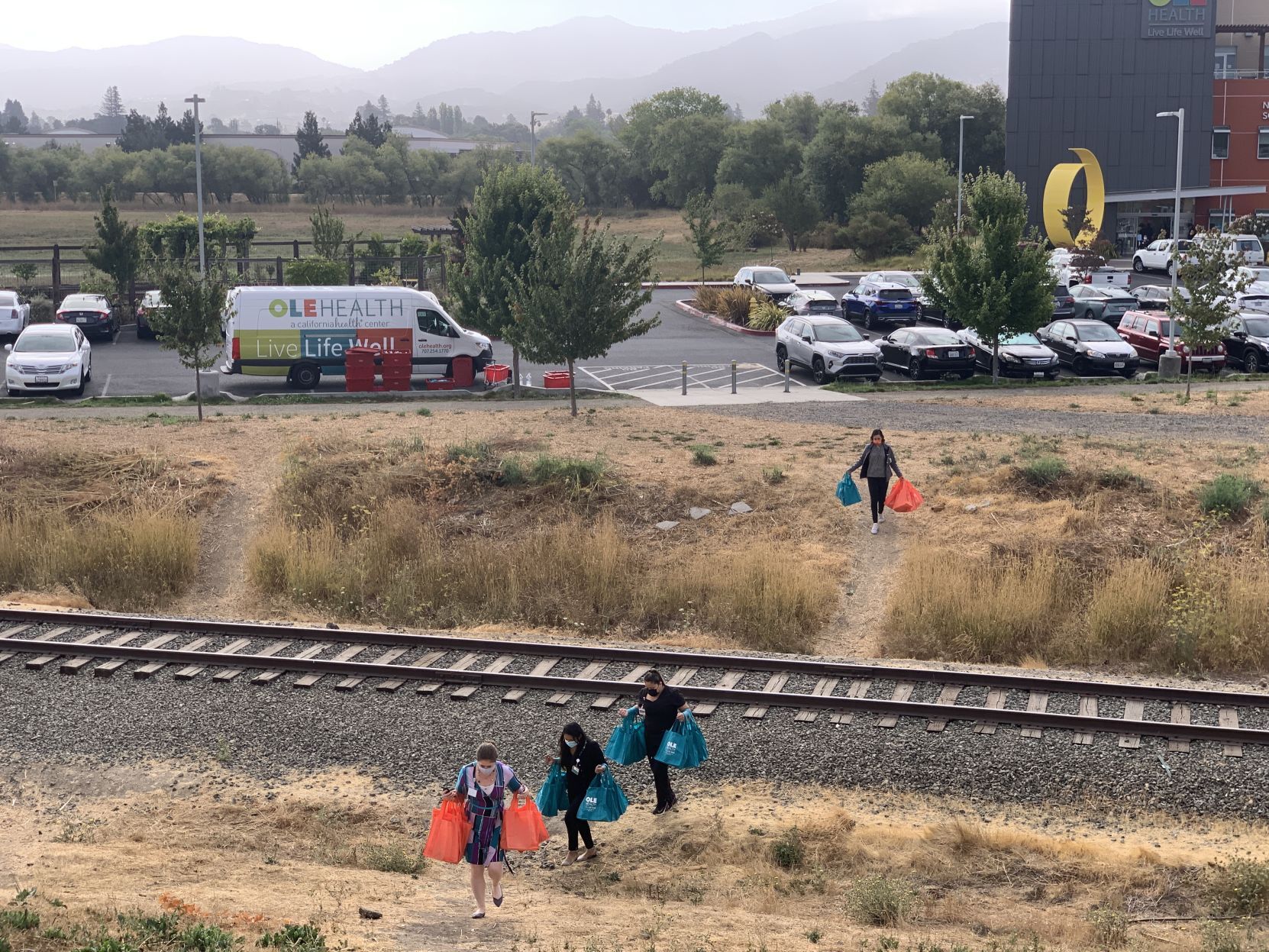OLE Health distributes care bags to residents of the Bowl